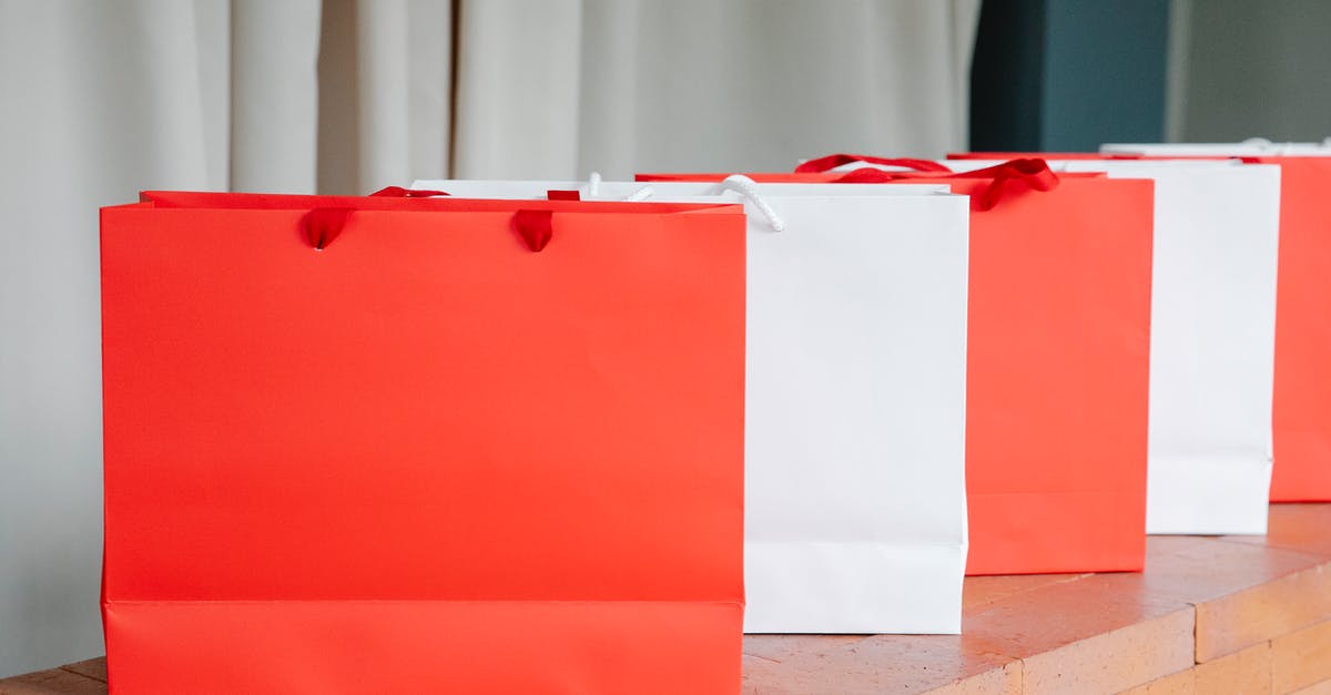 Ways to counter the burn of too many scallions? - Set of red and white paper shopping bags placed on brick shelf in studio