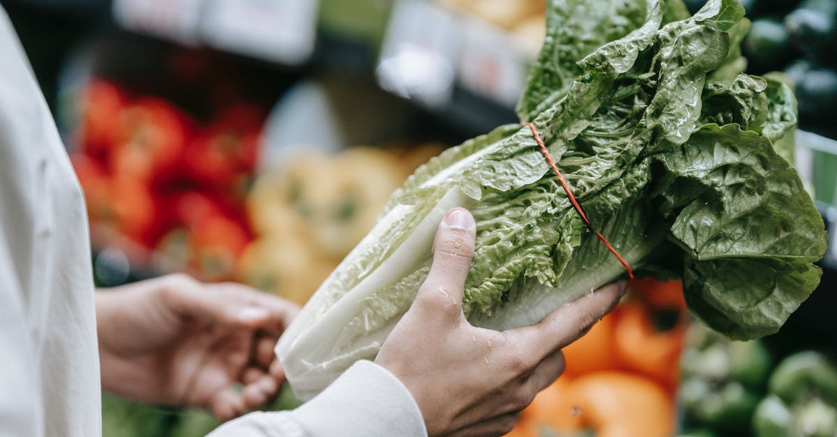 Ways to counter the burn of too many scallions? - Unrecognizable customer with fresh lettuce