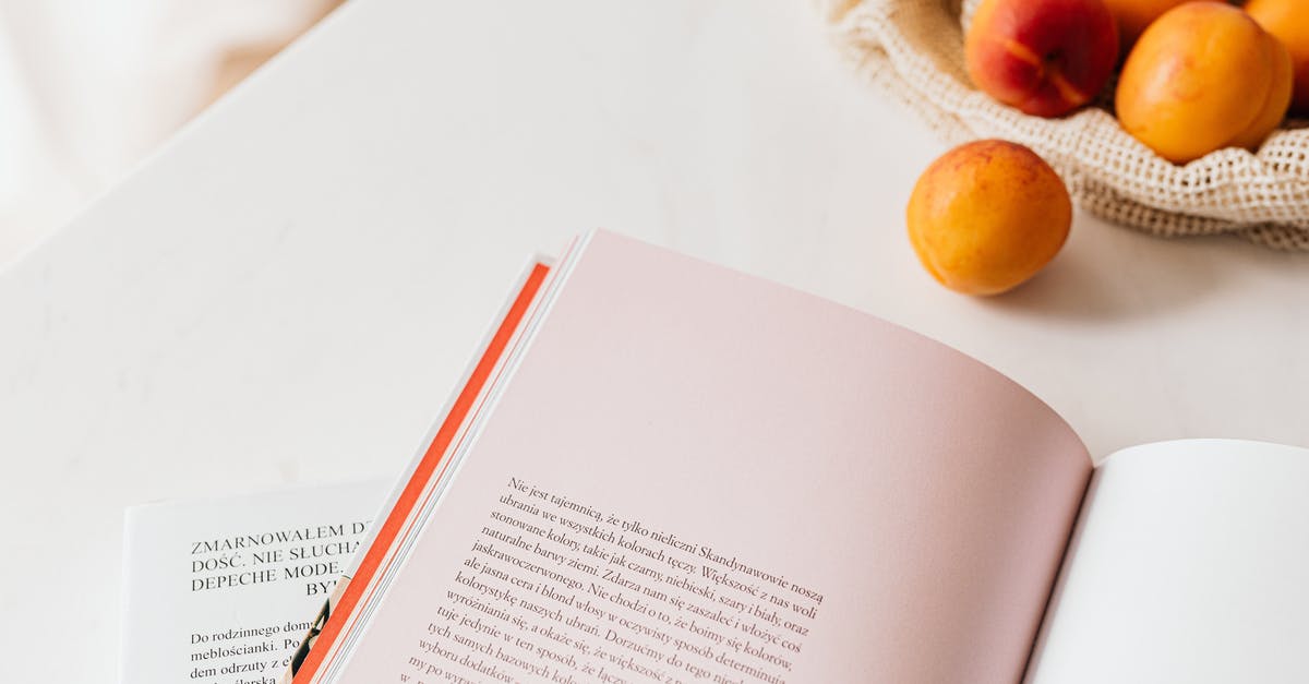 Ways to learn to season food correctly? - From above of opened book placed on white table near cotton sack with natural ripe apricots