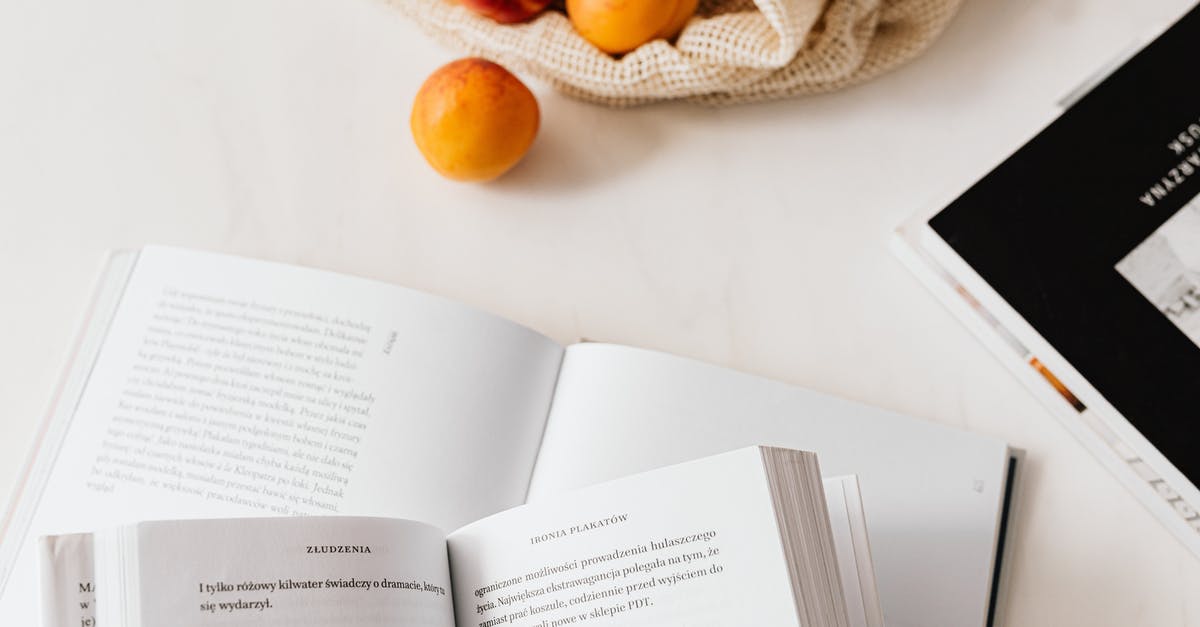 Ways to learn to season food correctly? - Jute sack with appetizing ripe apricots placed on table with different books