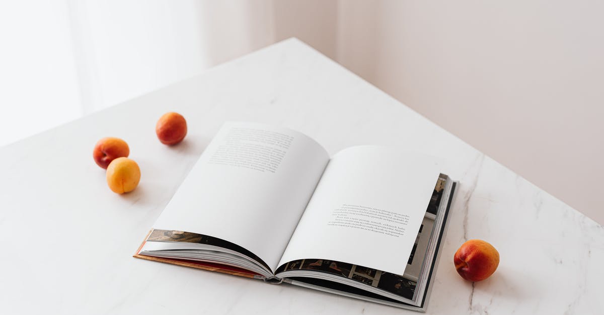 Ways to learn to season food correctly? - Opened book on table with fresh apricots