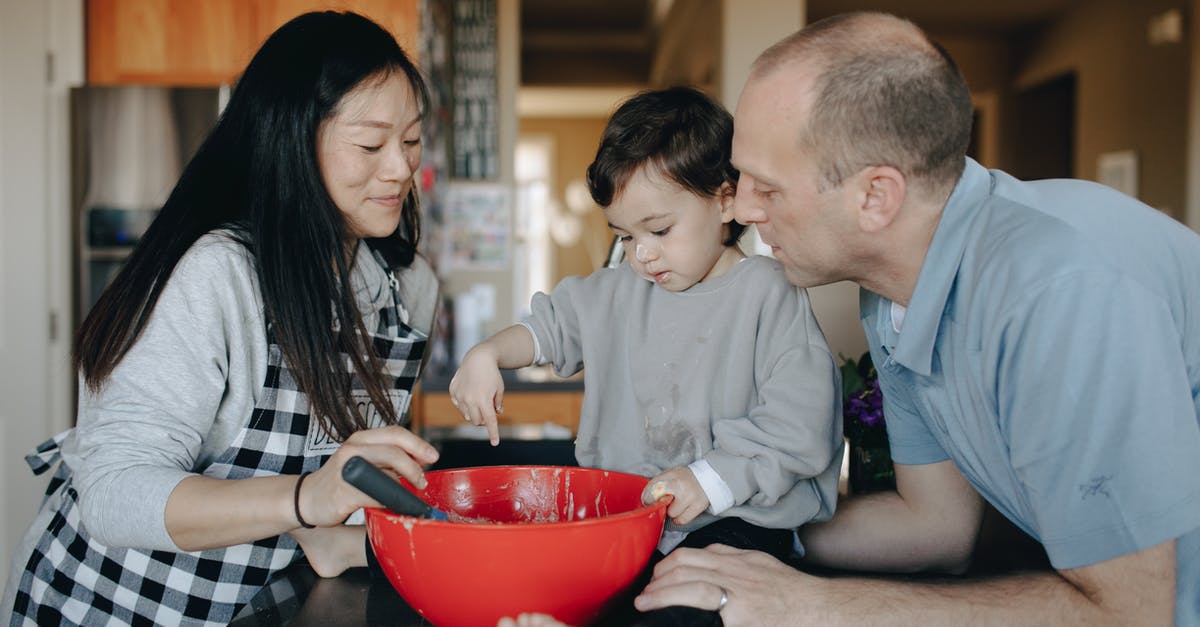 Ways to make my cooking routine more efficient? - A Couple Baking With Their Child