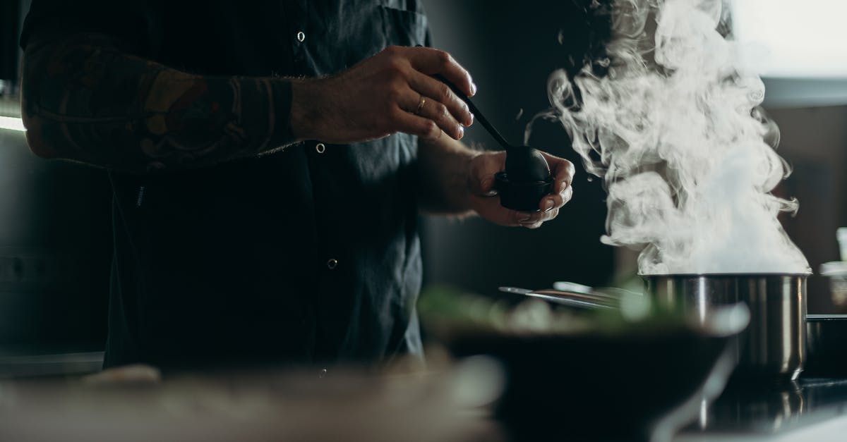 Weird Smoke Coming from Stock Pot on Stove - Man Cooking Food