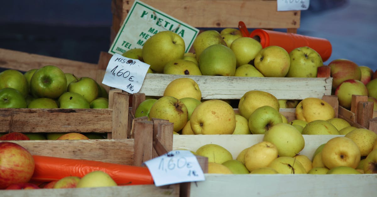 What's a good vegan substitute for sour cream? - Ripe apples in boxes on market