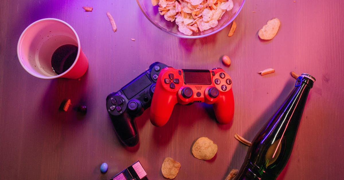 What's different between canned beer and bottled beer? - Messy Table with Game Controllers and a Beer Bottle