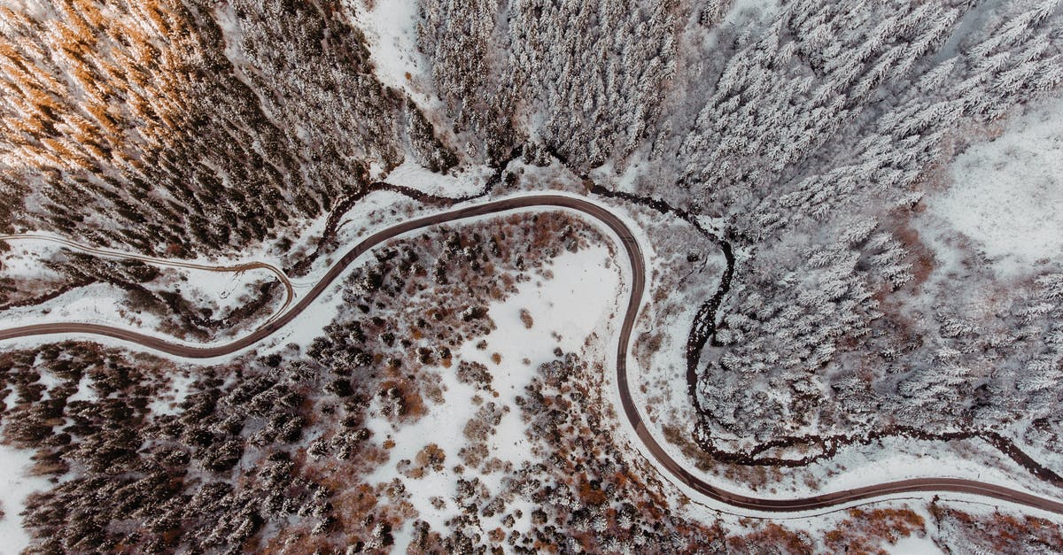 What's the best way to reheat frozen boiled potatoes? - Drone view of curvy roads running through winter forest