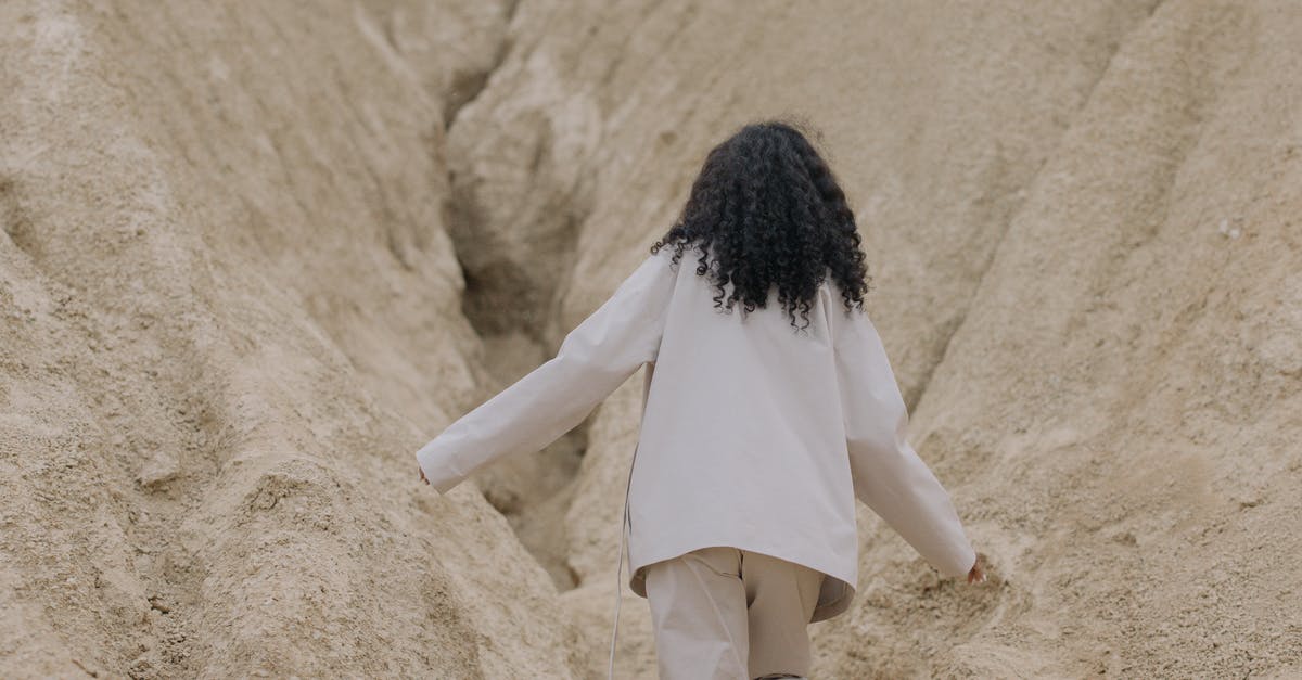 What's the difference between a cobbler, crisp, crumble, buckle, and betty? - Person in White Long Sleeve Shirt Walking Between Brown Rough Walls