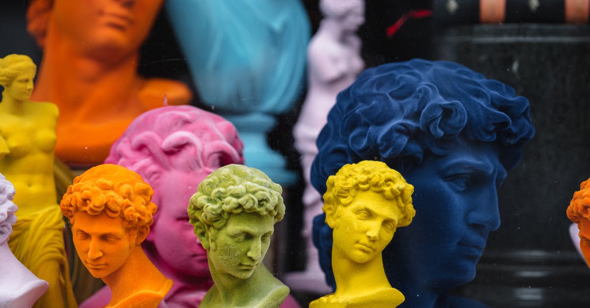 What's the difference between heirloom and direct-set yogurt cultures? - Collection of colorful head sculptures of David in different colors and shapes placed on counter in store with decorative souvenirs