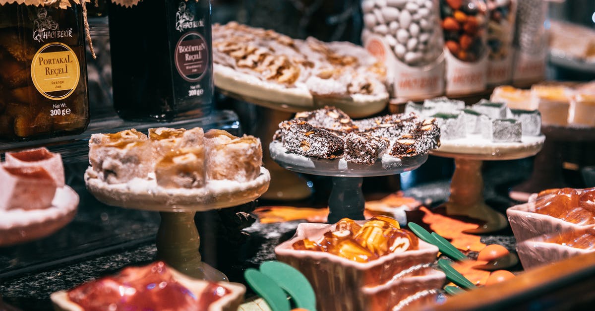 What's the difference between jam, jelly, and preserves? - Assorted Turkish delights and jam on showcase of market selling delicious traditional sweets