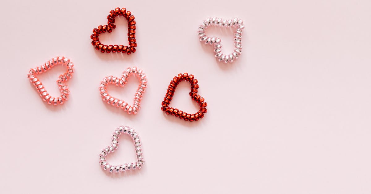 What's the difference between pearl quinoa and 'regular' quinoa? - Multicolored decorative hair ties in heart shape on pink background