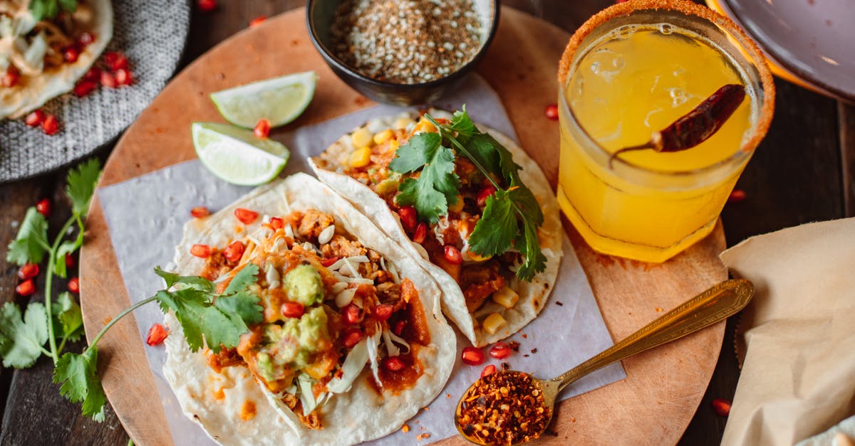 What's the line between salsa and guacamole? - Tacos on a Cutting Board, Juice in Glass and Spices 