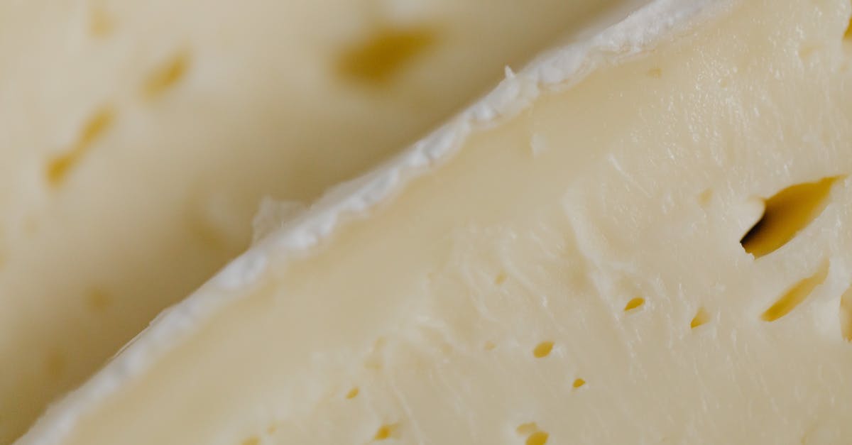 What's the most efficient/effective method for removing the rind of a well-ripened Brie? - White Cheese in Close-up Photography