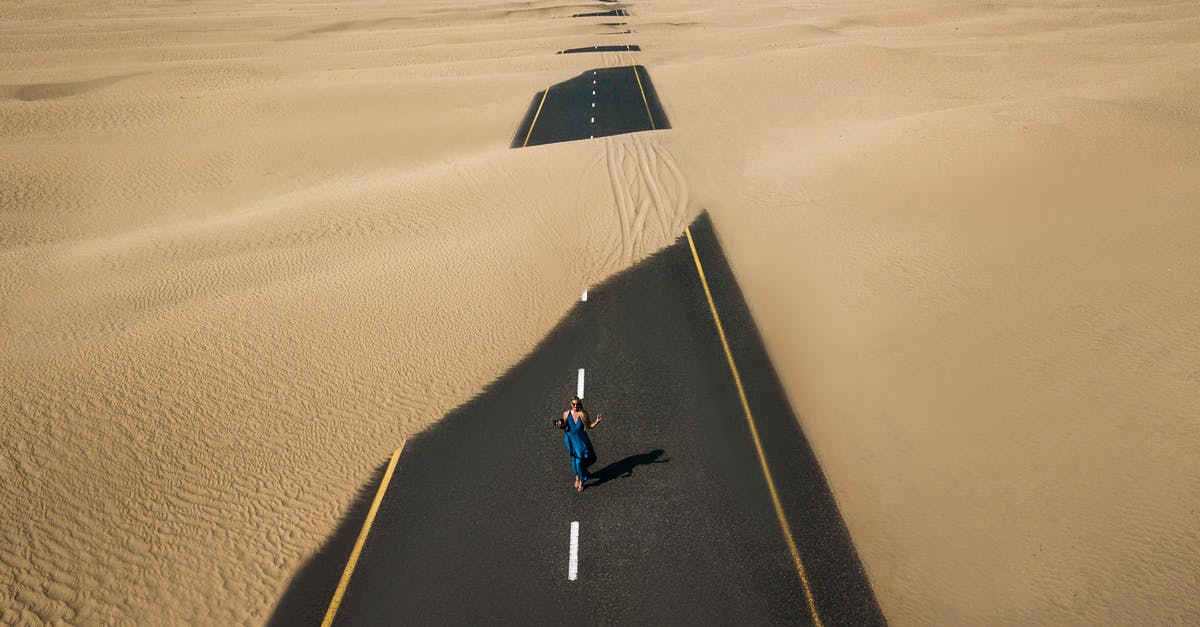 What's the point of the first action in double-acting baking powder? - Bird's Eye View Photography of Road in the Middle of Desert