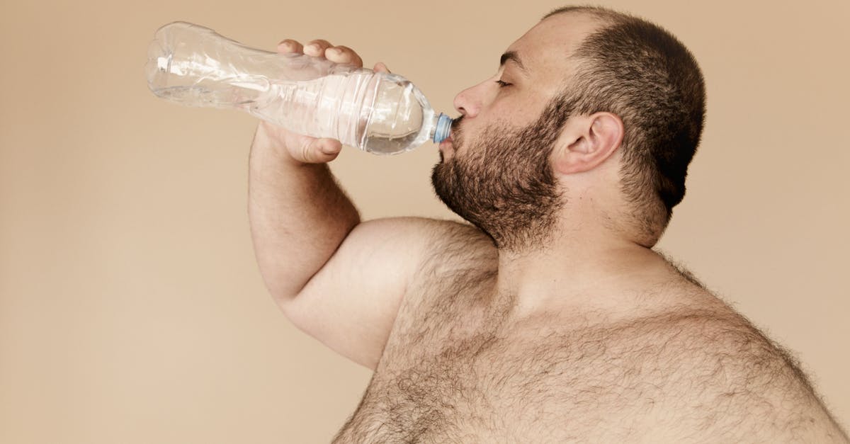 What's the skinny on fat asparagus? - Man Drinking from Clear Plastic Bottle