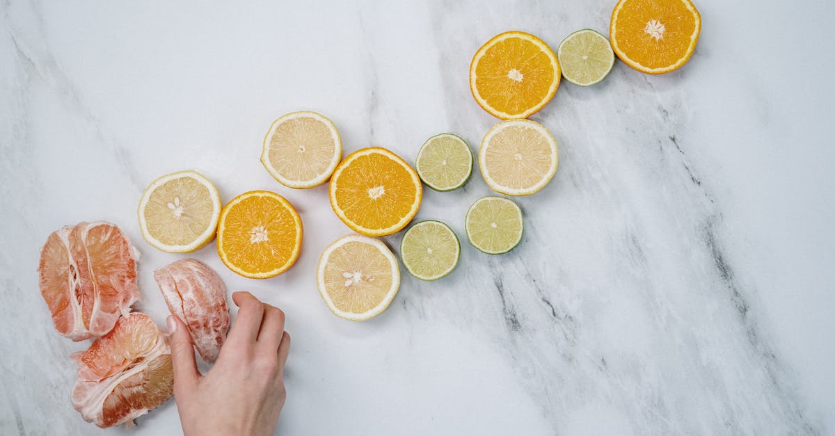 What's this orange jelly on pomelo? - Sliced Orange Fruits on White Table