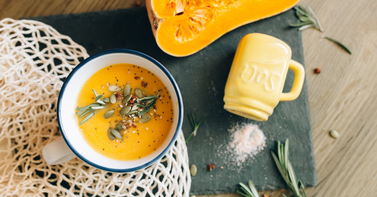 What are good ingredients to put into a Scrapple soup stock? - Yellow Puree on White and Blue Ceramic Mug