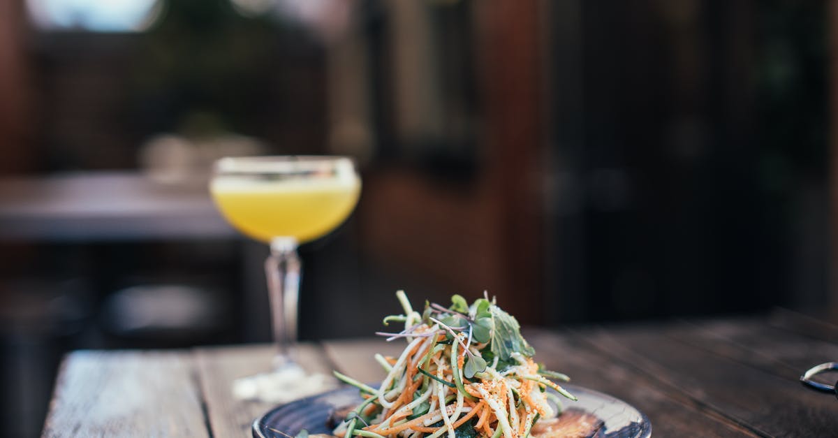 What are ‘fresh noodles’ in a salad - Delicious noodle salad with cocktail in bar