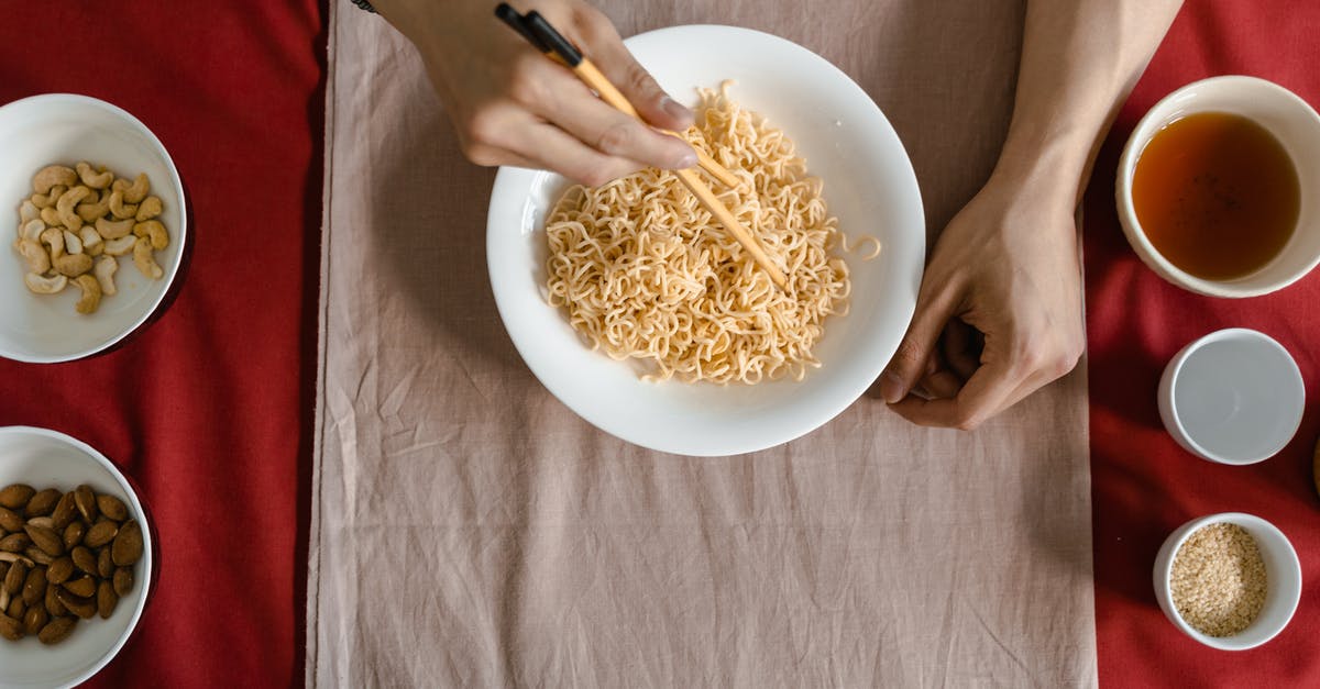 What are Maggi noodles and what's a good bulk substitute? - Person Holding White Ceramic Bowl With Pasta