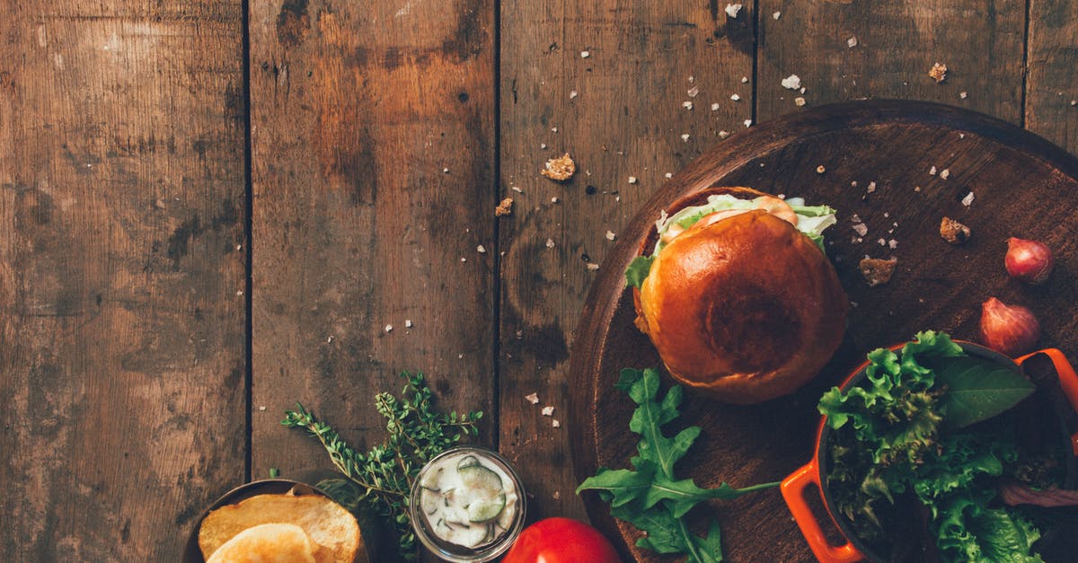 What are "cooked" potatoes? - Burger and Vegetables Placed on Brown Wood Surface