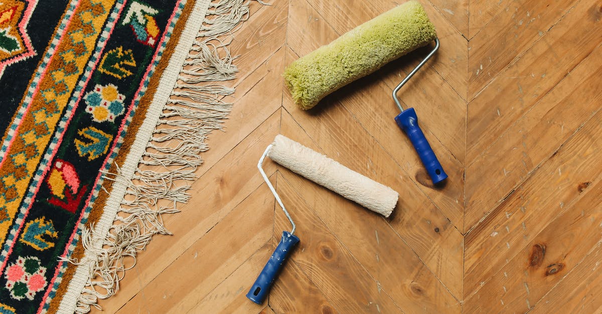 What are some grilling tools that everyone should have? - Blue and Silver Hair Brush on Brown Wooden Floor