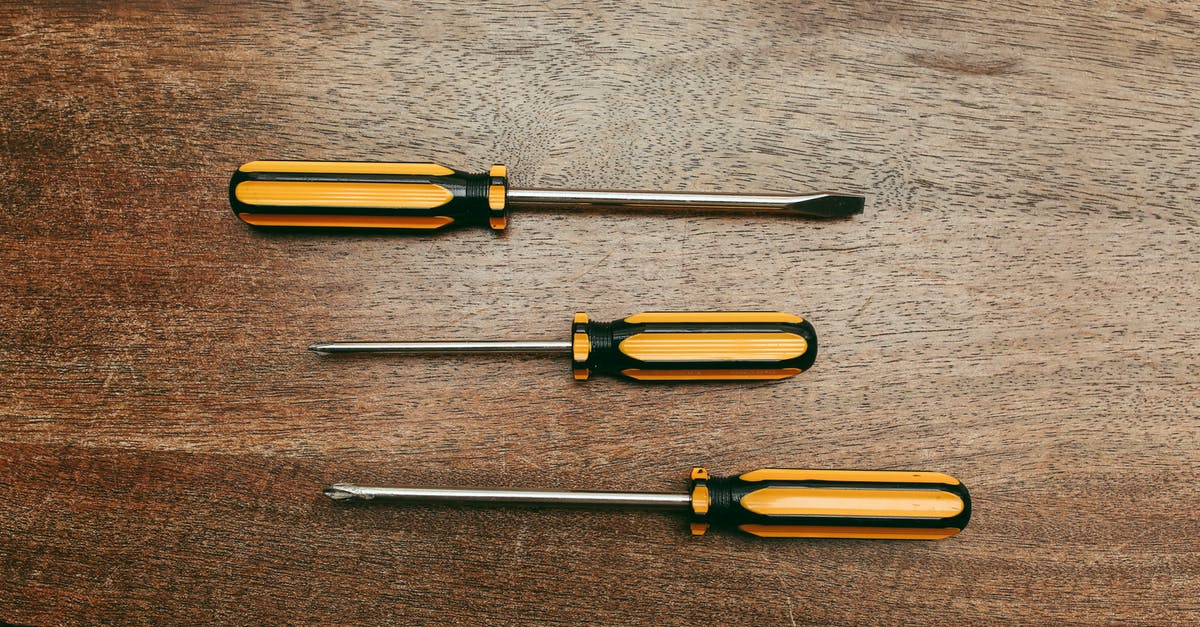 What are some grilling tools that everyone should have? - Yellow and Silver Screw Driver