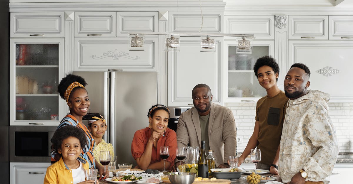 What are some kid-friendly dishes from Kenya? - Family Posing for a Photo in the Kitchen