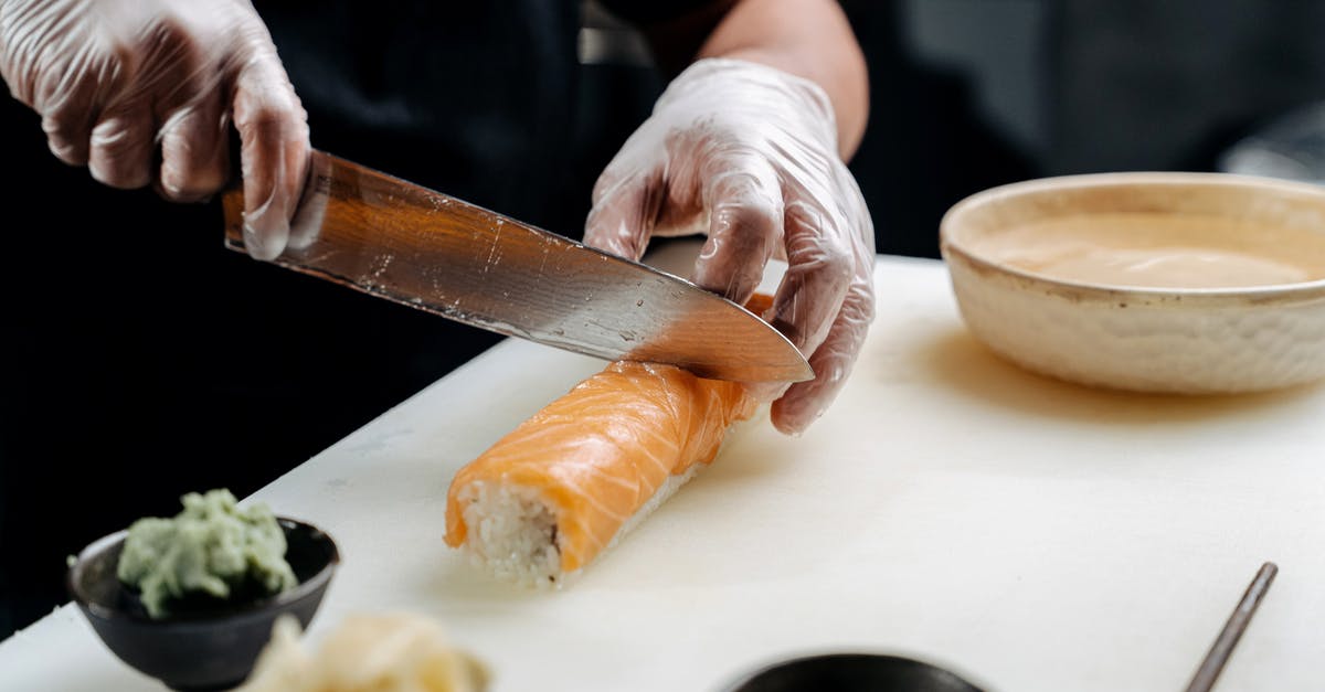 What are the best suggestions for cutting gloves - A Person Cutting Sushi