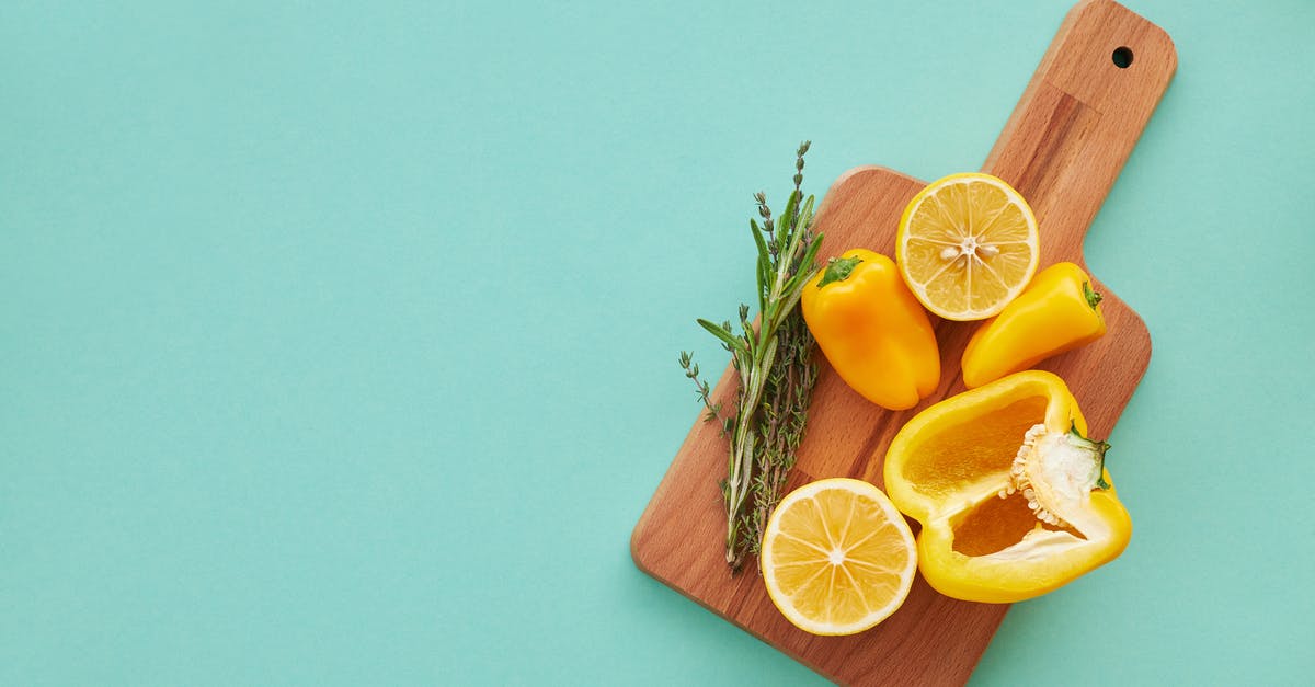 What are the key differences between lemons and meyer lemons? - Sliced Orange Fruit on Chopping Board