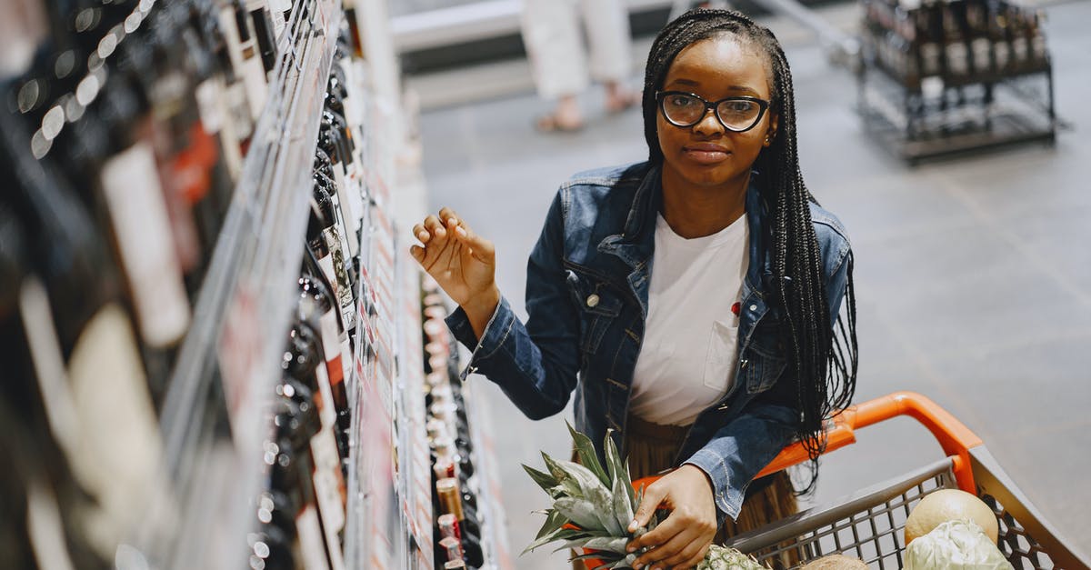 What are the most yeasty fruits sold in supermarkets suitable for providing yeast for making bread? - Woman in Black Leather Jacket Holding Pineapple Fruit