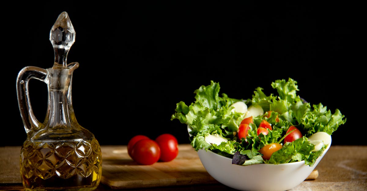 What are the transparent strands in this salad? - Vitamin vegetable salad on table with bottle of oil