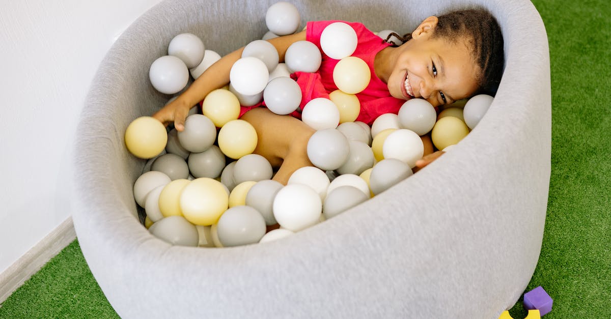 What are these little balls in my sardines? - Girl With Braided Hair Playing Balls In A Tub