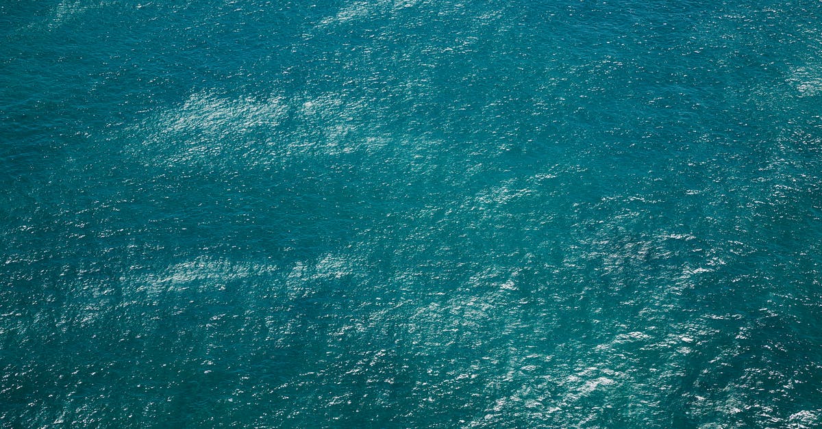 What are these little crystals in my Cheese? - Drone view of rippling azure pure water of sea with little waves running on surface