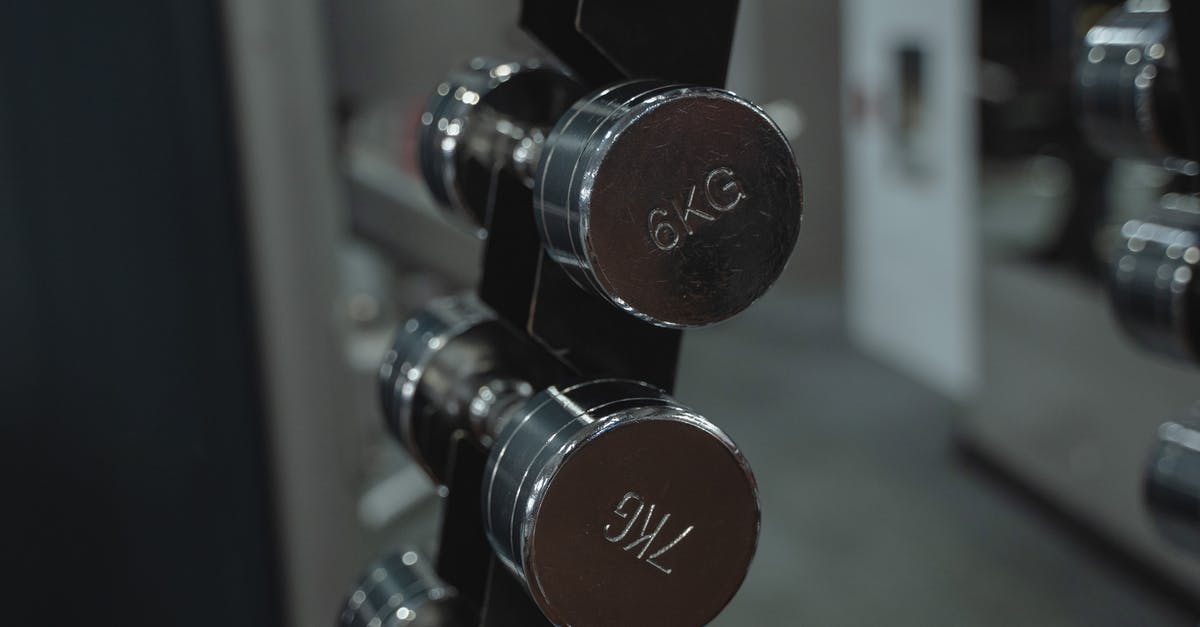 What are these silver "sporks" for? - Black and Red Dumbbells on Rack