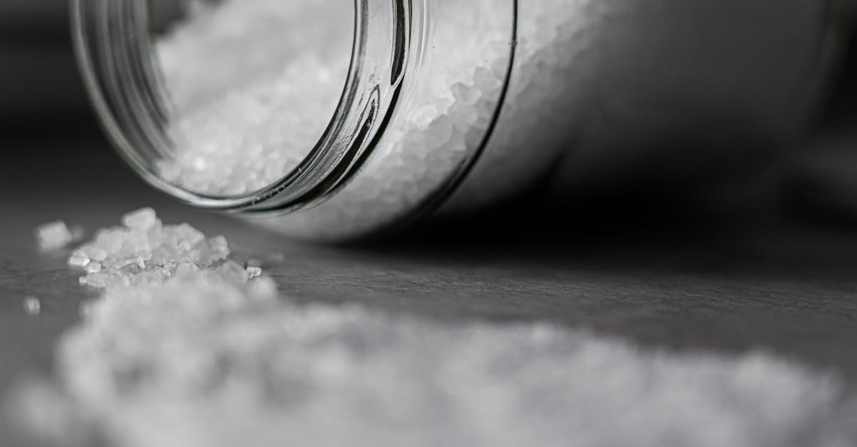 What are these small salty peppers from The Cheesecake Factory? - Selective Focus Photo of Salt in Glass Jar