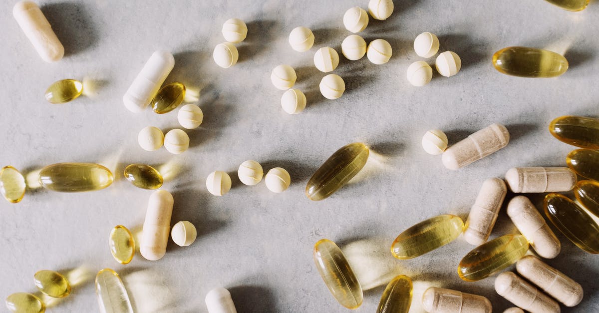 What can I add to Splenda solution to prevent spoilage? - Top view of scattered set of pills and dietary supplements to prevent lack of vitamins on table in light studio