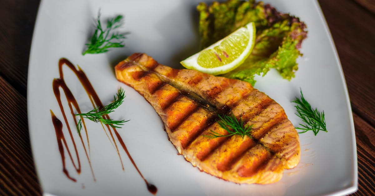 What can I substitute for Kaffir Lime Leaves? - A Slice of Grilled Fish and Lime on a Square Ceramic Plate