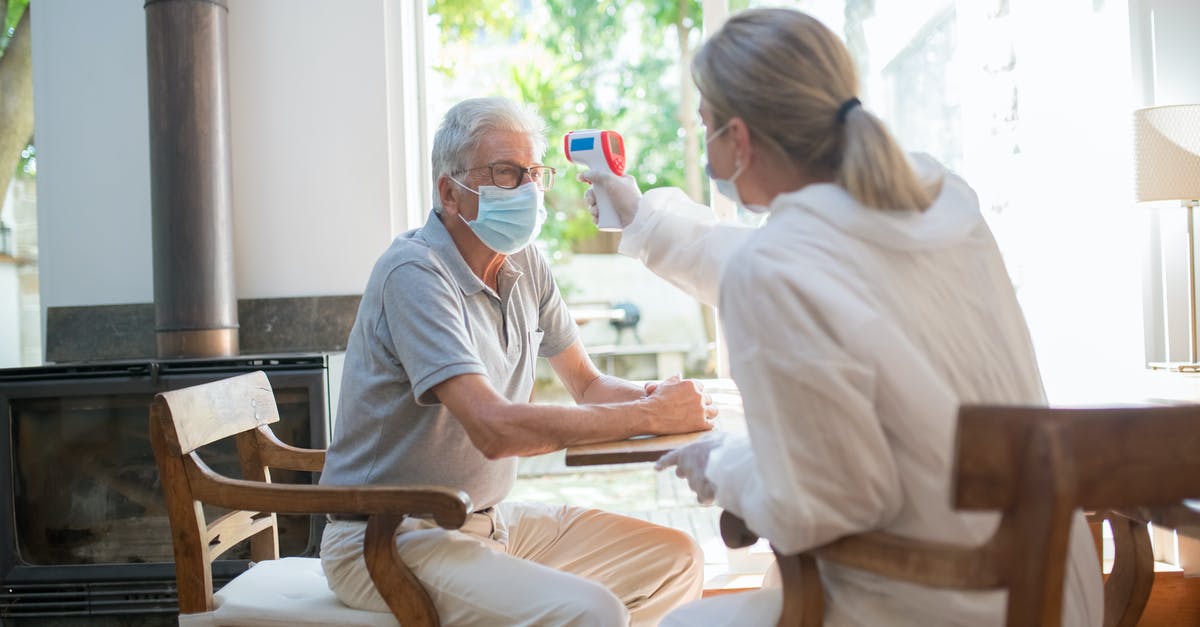 What can you do with an infrared thermometer? - A Person Scanning  the Temperature of a Man with a Laser Thermometer