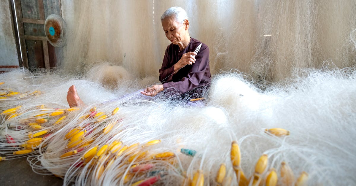 What causes butter to make risotto shiny? - Senior Asian woman making fishing net at home