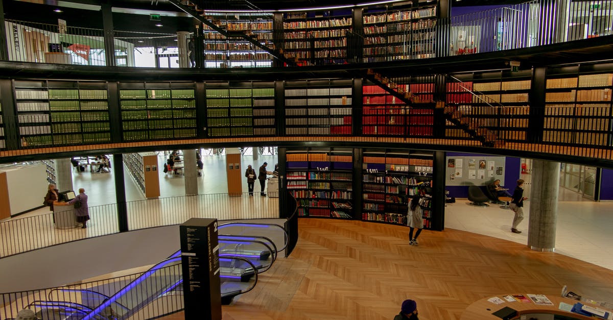 What cheese might compliment New England clam chowder? [closed] - People in modern library with books