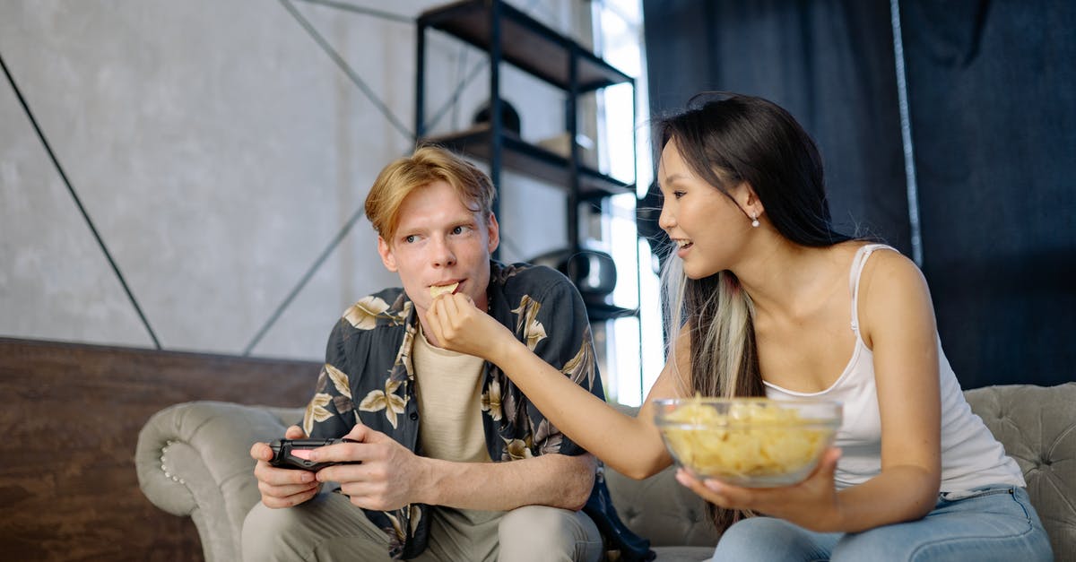 What constitutes a 'waxy potato' - Woman in White Tank Top Sitting on Mans Lap