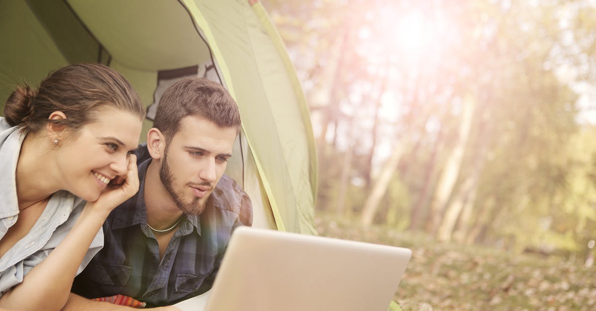 What could this utensil pair be used for? - Couple Lying on Tent Using Computer Laptop