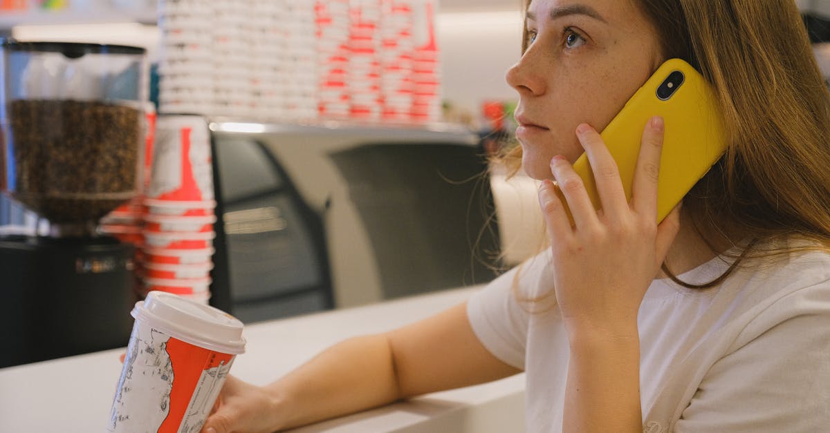 What counters astringency? - Woman in White Shirt Holding Yellow Cellphone