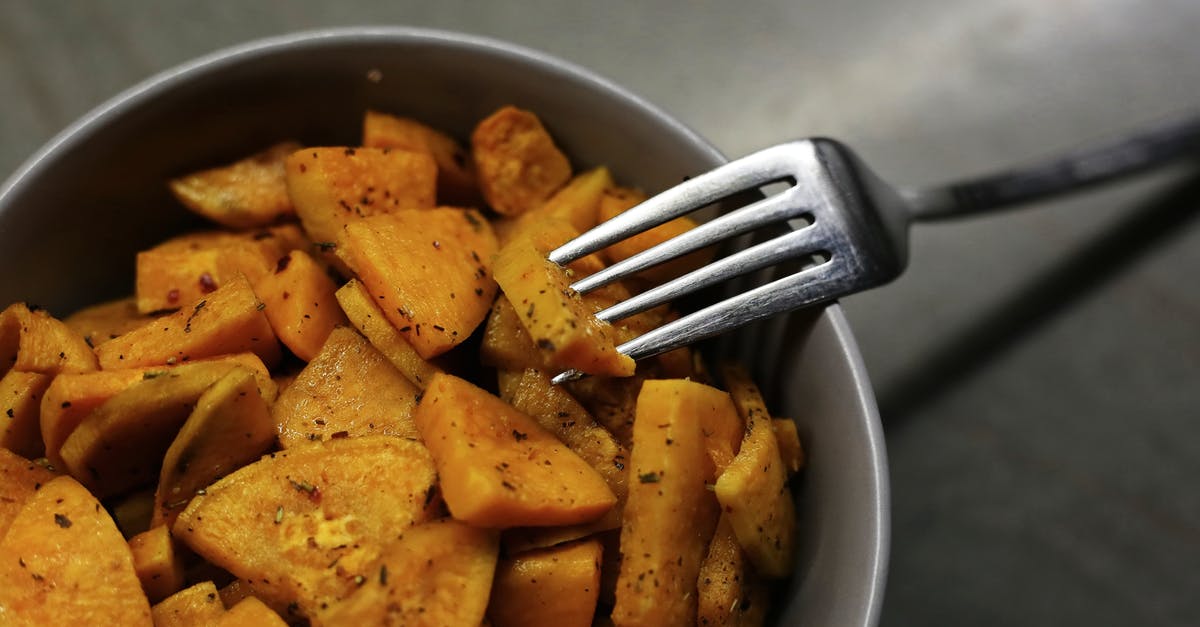 What determines sweet potato softness? - From above yummy organic sweet potato fried with herbs and seasonings served in bowl with fork
