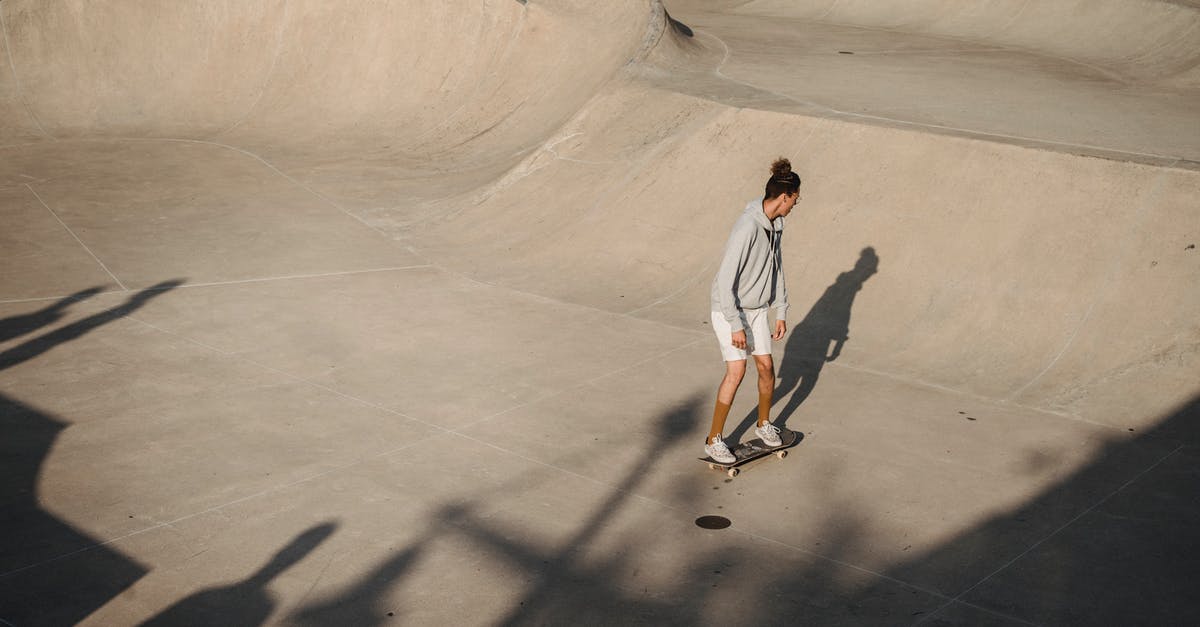 What determines the shape-holding ability of cookies? - From above of anonymous young sportsman performing stunt on skateboard on asphalt ramp during outdoor training on sunny day