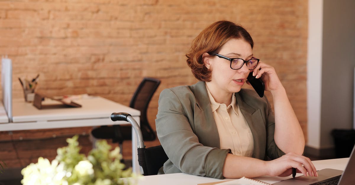 What determines total heat when using chilis? Quantity × intensity? - Photo of Woman Talking Through Smartphone While Using Laptop