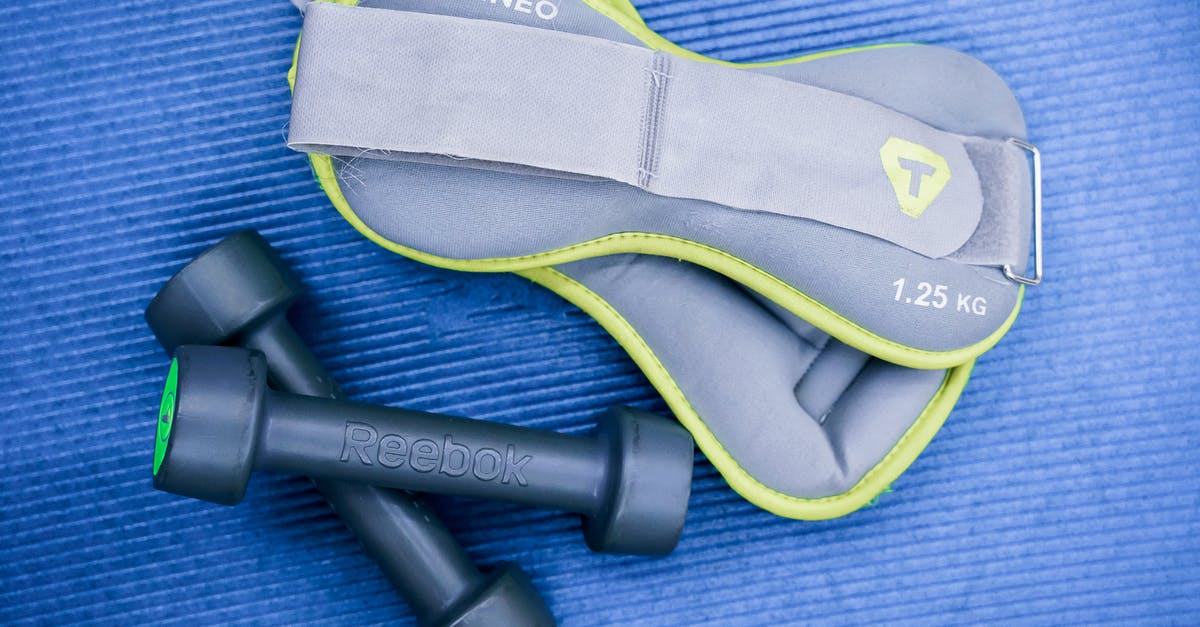 What determines whether a sherbet will set or not? - From above of modern dumbbells and leg weight belts placed on blue fitness mat in studio