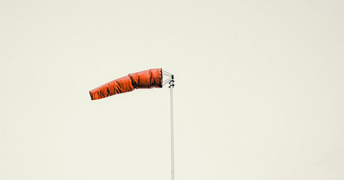 What determines whether a sherbet will set or not? - Red windsock on pole against gray sky