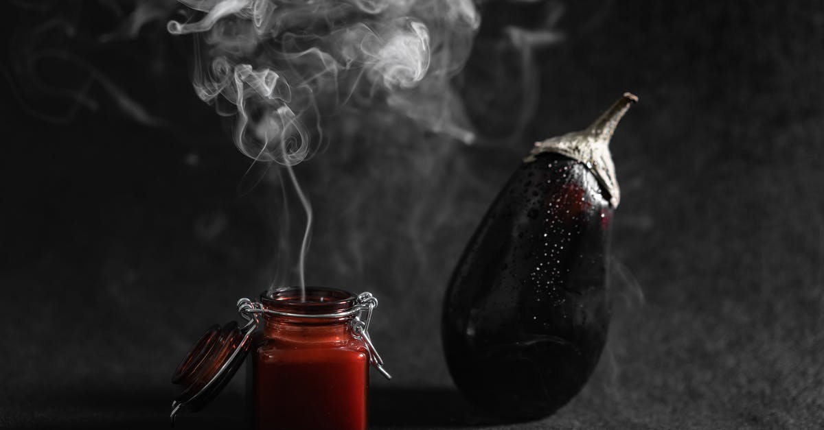 What does a Thai Scented Candle impart? - Smoke Coming Out From A Burnt Scented Candle Beside An Eggplant