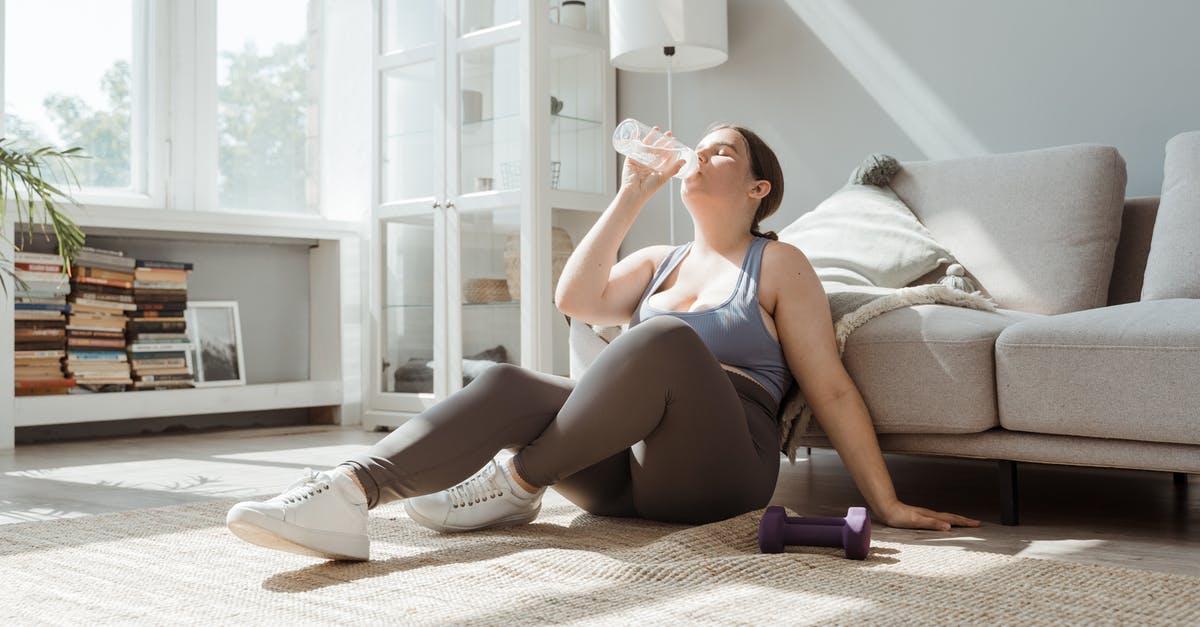 What does resting mean - Woman in Blue and White Tank Top and Black Shorts Sitting on White Couch