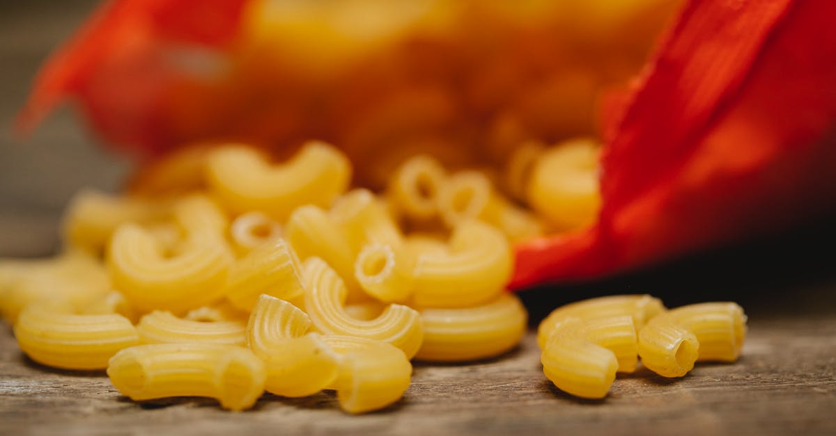 What dough recipes are suitable for "shaping" with a piping bag? - Heap of raw textured pasta scattered on table